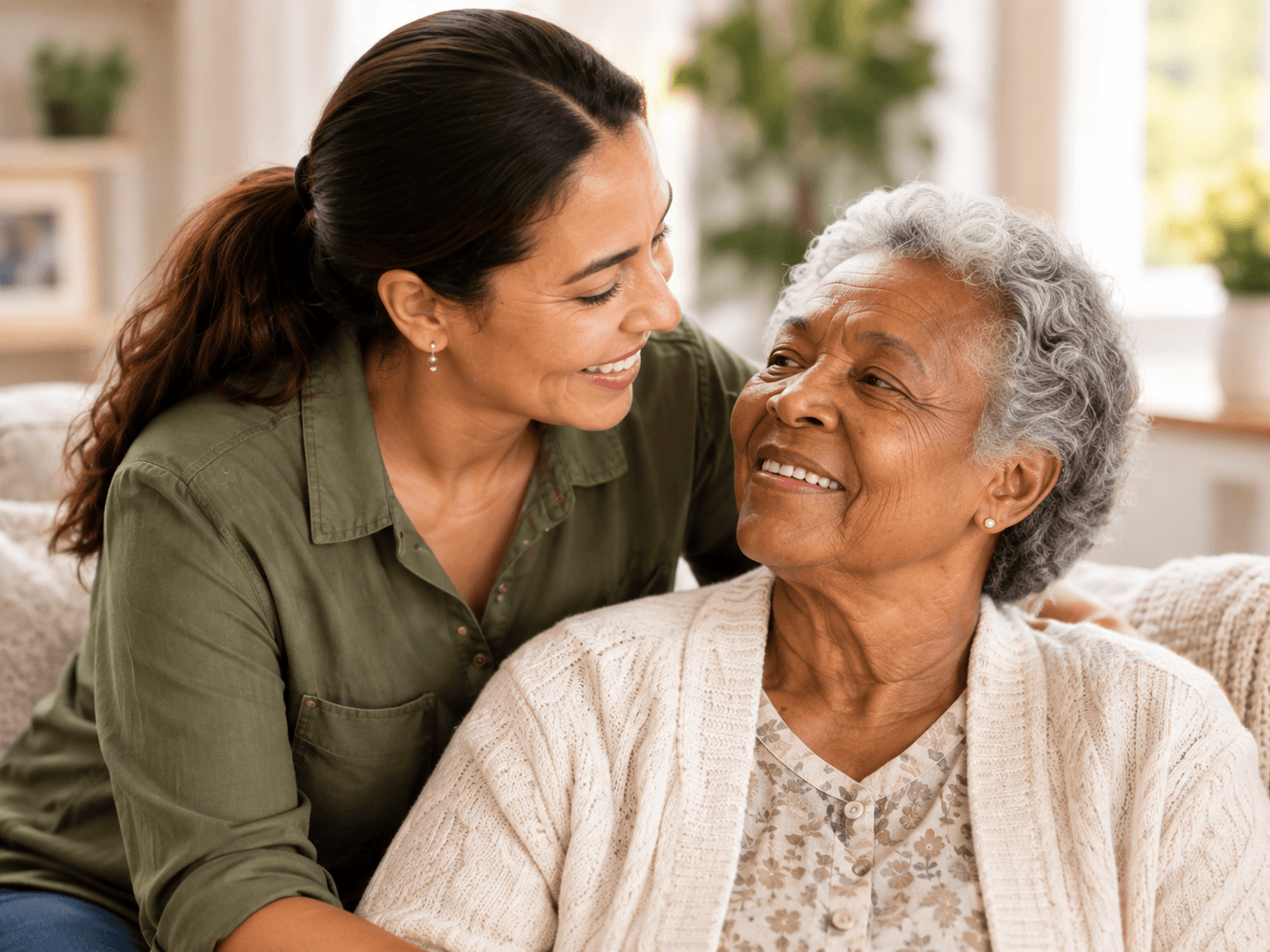 A family caregiver sharing a warm moment with an older woman